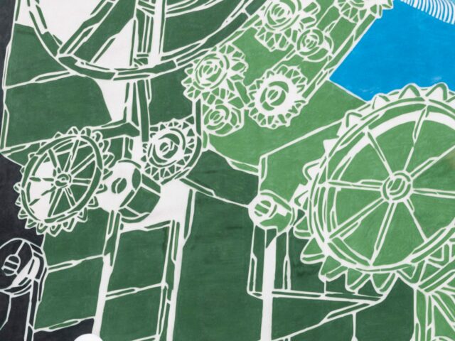 green, black, white, and blue textile